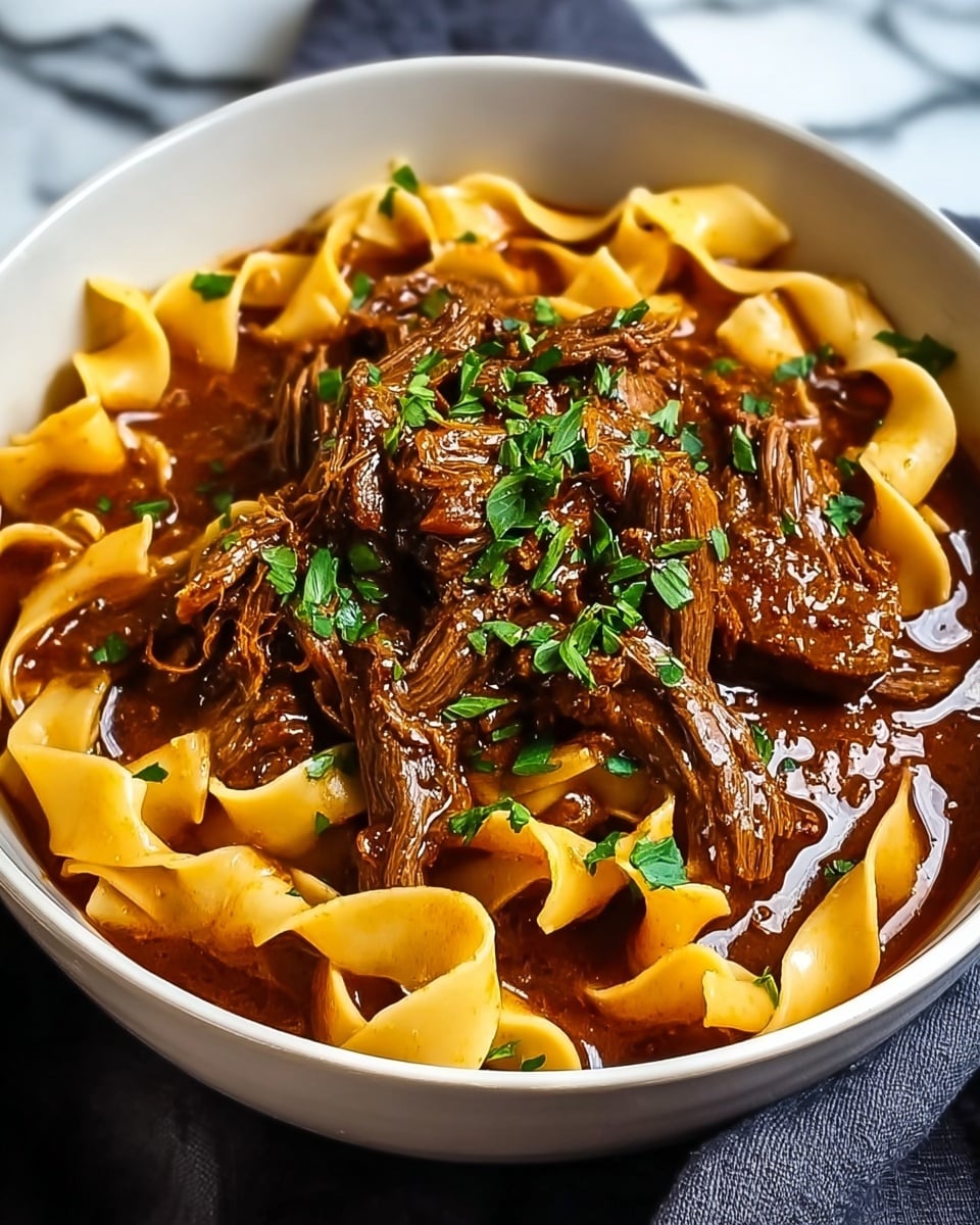 A white bowl filled with three main layers: the bottom layer is wide, flat noodles in a pale yellow color with soft, slightly curled edges; the middle layer is thick, rich brown sauce coating the noodles; the top layer consists of tender, dark brown slices of beef mixed well with the sauce, sprinkled with small white sesame seeds and bright green chopped herbs on the very top to add fresh color. The bowl is placed on a white marbled surface and partially shows a blue cloth beneath it. photo taken with an iphone --ar 4:5 --v 7
