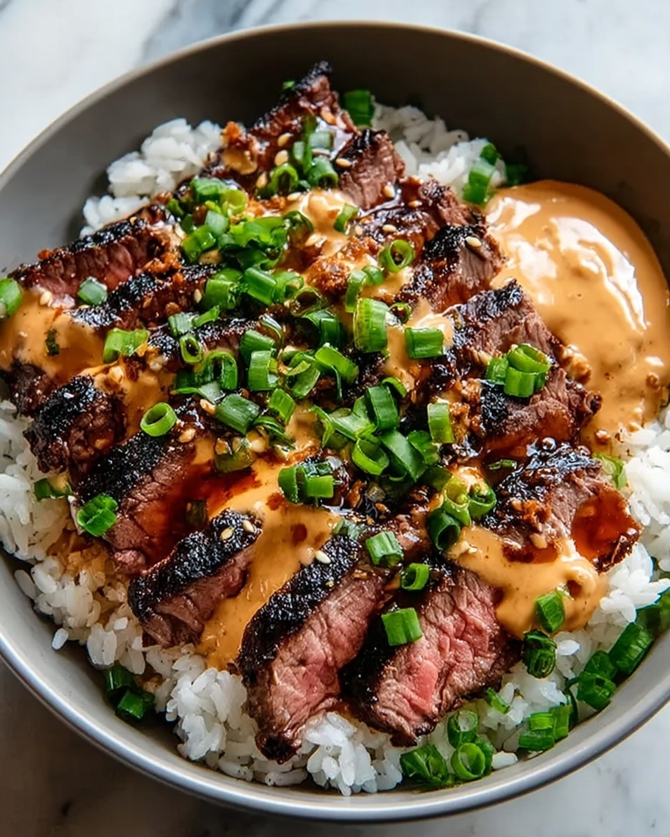 A white bowl filled with a base layer of white rice topped with several slices of grilled steak, each piece showing a juicy pink center and charred edges. The steak slices are drizzled with a creamy orange sauce and a darker soy-like sauce, adding rich color contrast. Chopped green onions are sprinkled generously over the steak and sauce, and a dollop of light brown sauce sits at the edge of the bowl. The bowl is placed on a white marbled surface. Photo taken with an iphone --ar 4:5 --v 7